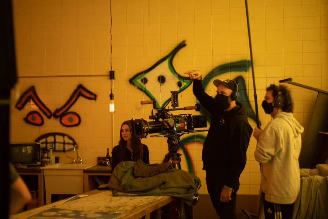 Behind the scenes photo 21 from Clone Cops production showing cinematographer corey allen, boom operator jared grimes, and quinnlan ashe preparing for a scene